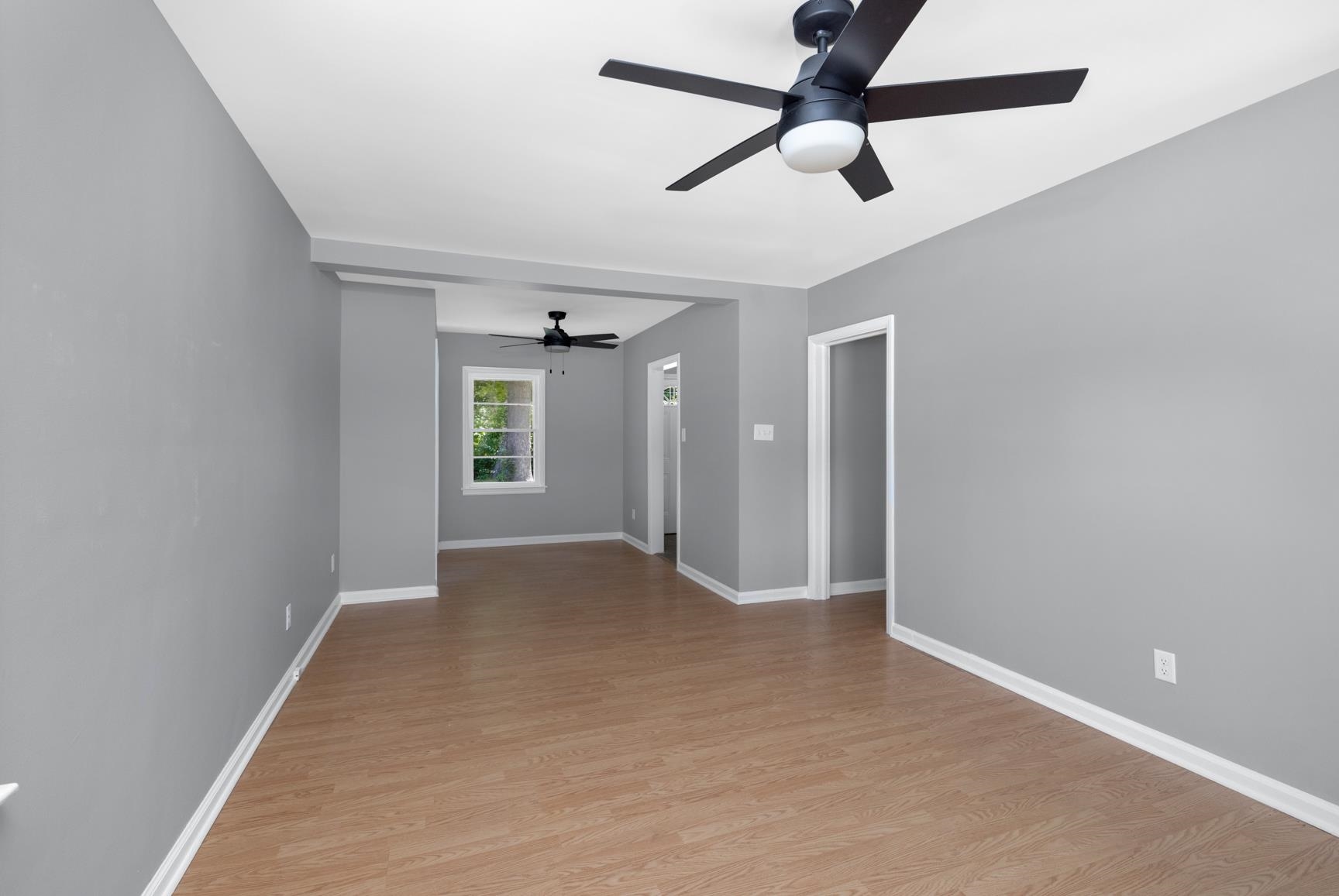 7662 Marvin Road Millington, TN 38053 - Photo 6 of 20 Bright interior space featuring light wood-finish flooring, neutral gray walls, and white trim