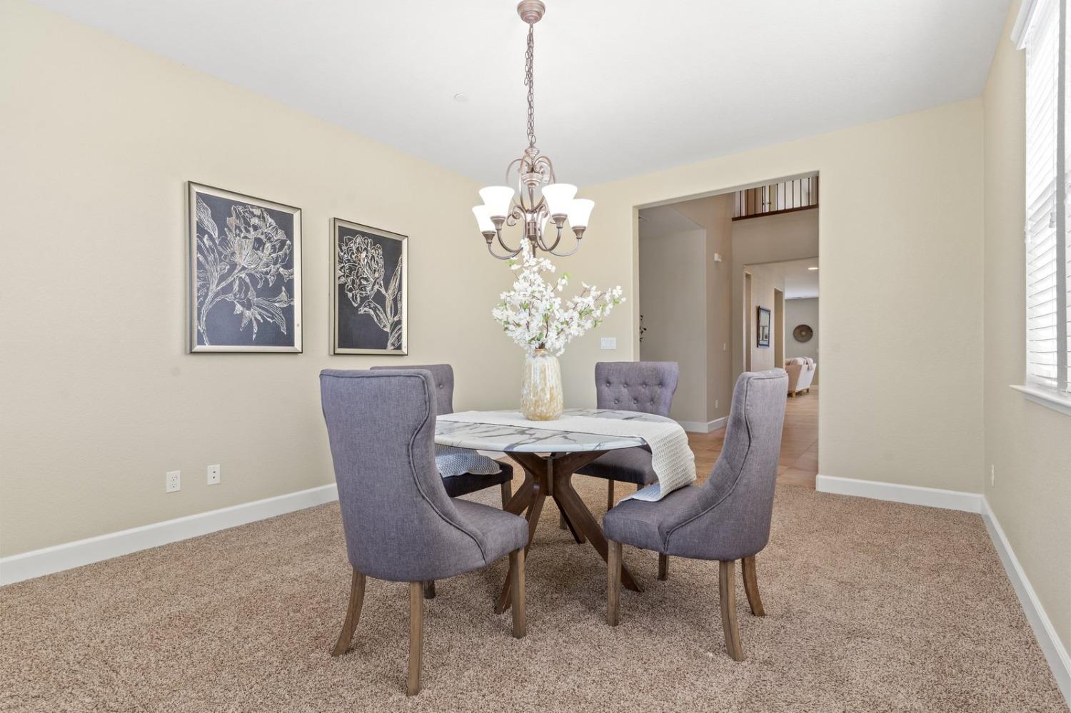 6307 Lookout Pass Way Rocklin, CA 95765 - Photo 12 of 72 a dining room with furniture and window