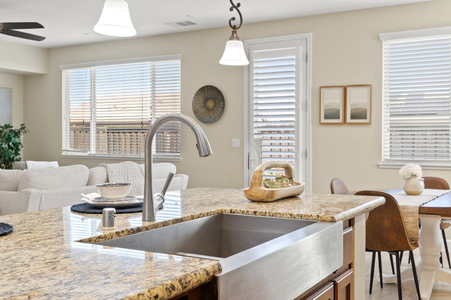 6307 Lookout Pass Way Rocklin, CA 95765 - Photo 23 of 72 a kitchen with a stove a sink and a refrigerator