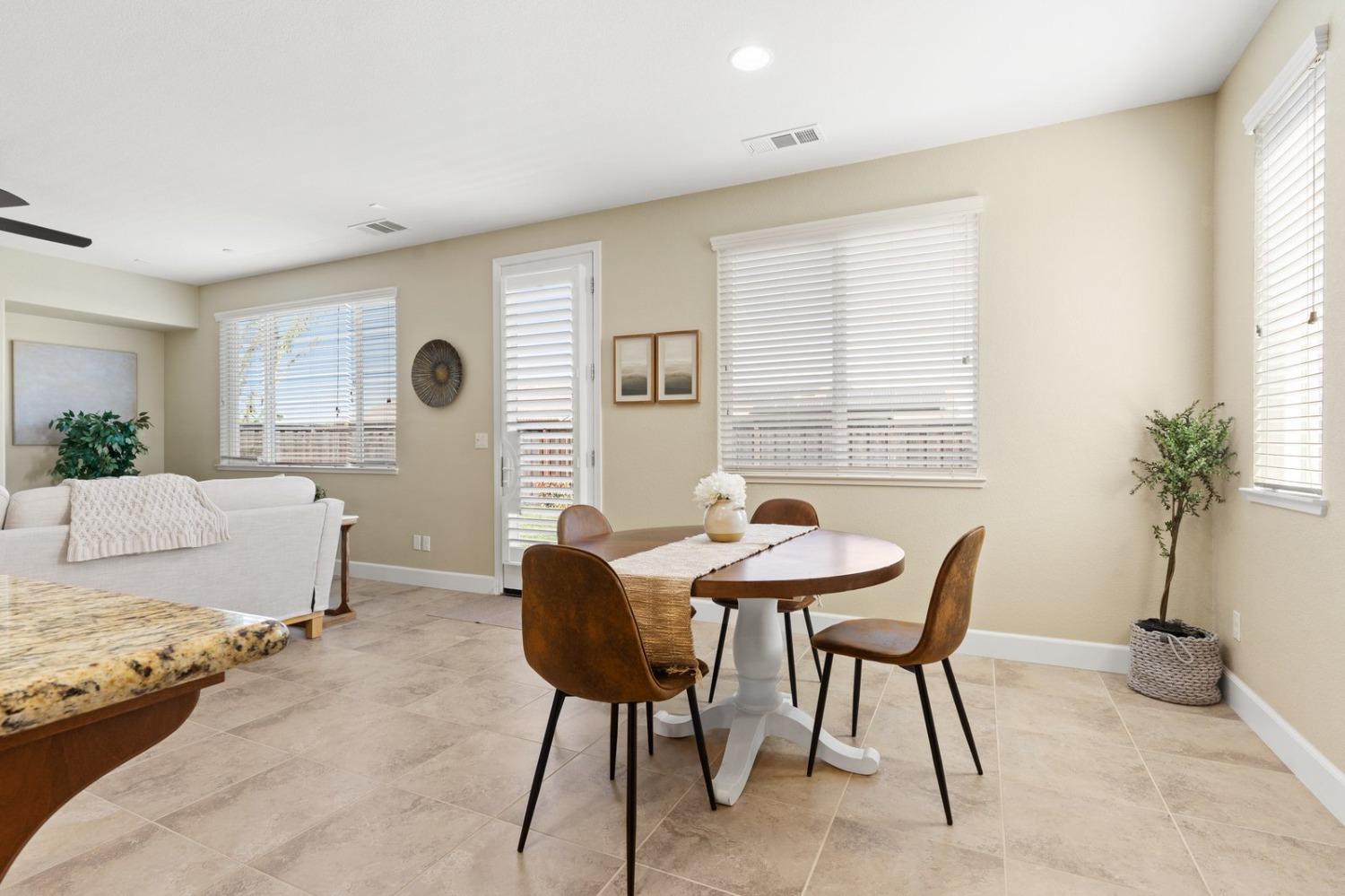 6307 Lookout Pass Way Rocklin, CA 95765 - Photo 25 of 72 a living room with furniture and a potted plant