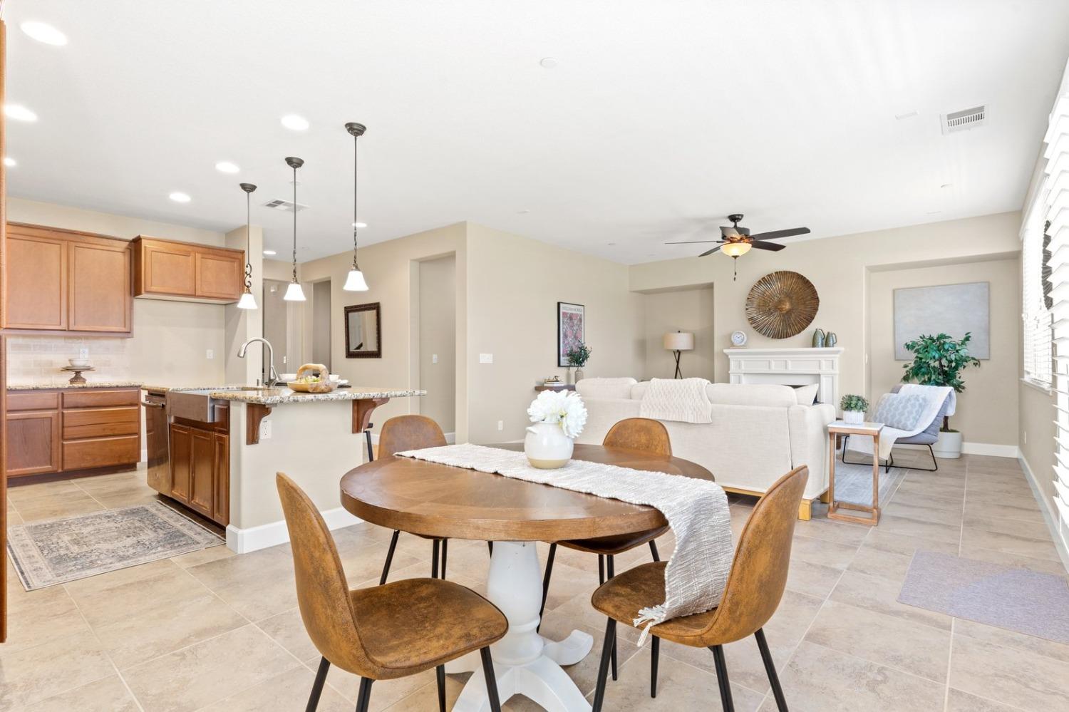 6307 Lookout Pass Way Rocklin, CA 95765 - Photo 26 of 72 a view of kitchen with a dining table and chairs