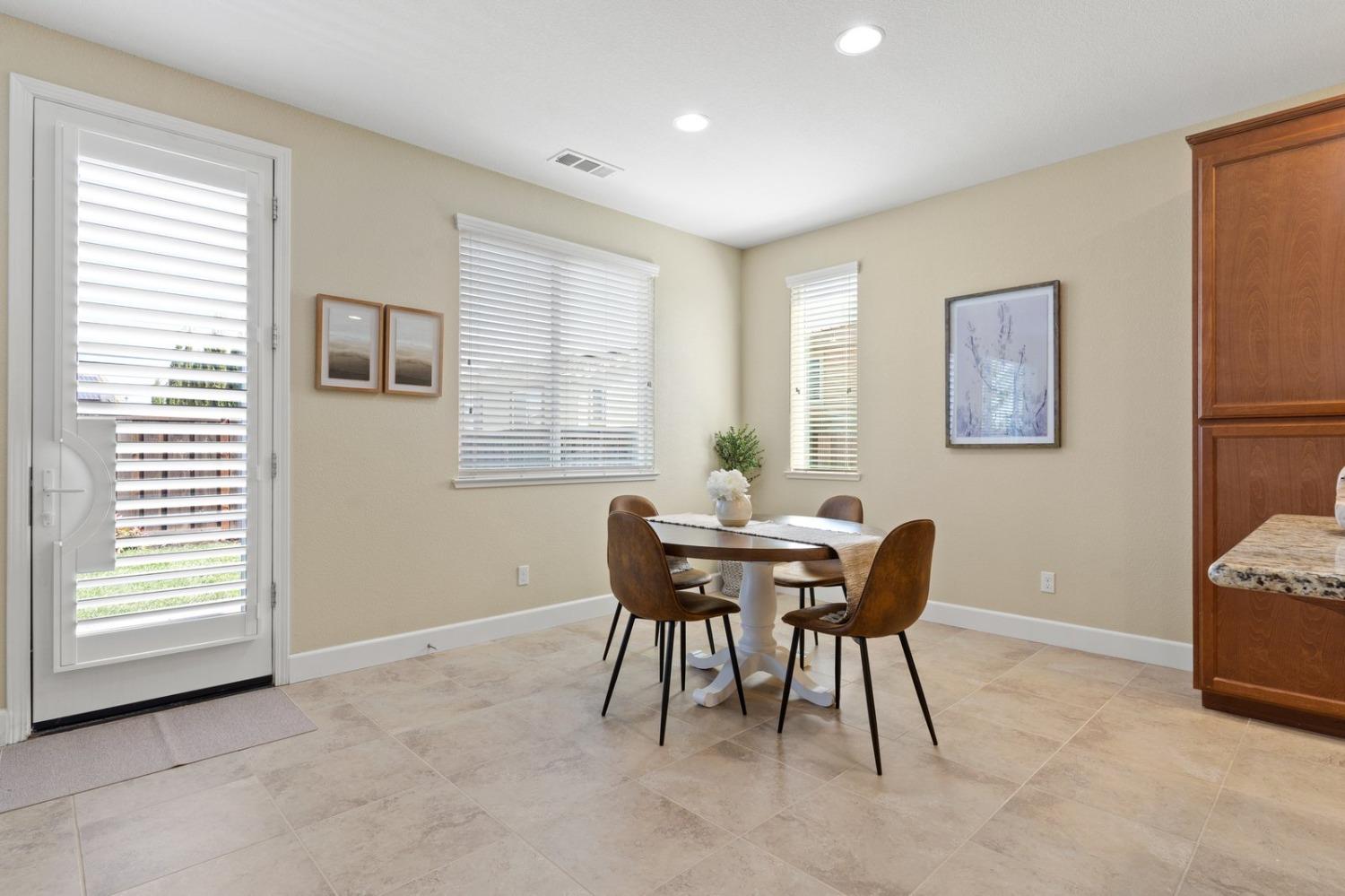 6307 Lookout Pass Way Rocklin, CA 95765 - Photo 27 of 72 a view of a dining room with furniture and a window