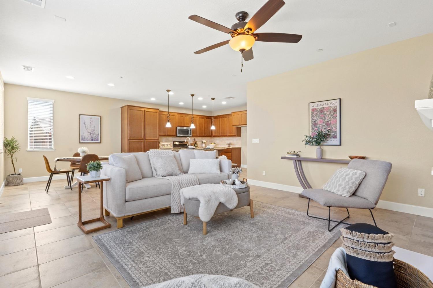 6307 Lookout Pass Way Rocklin, CA 95765 - Photo 33 of 72 a living room with furniture and a chandelier