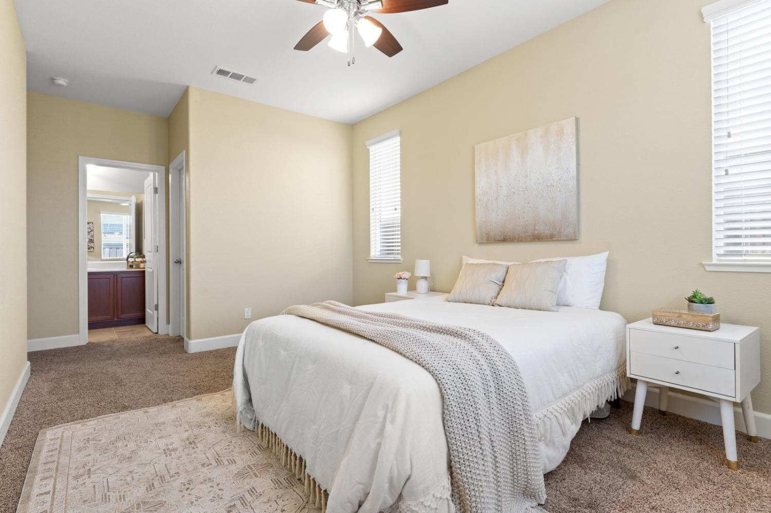 6307 Lookout Pass Way Rocklin, CA 95765 - Photo 38 of 72 a bedroom with a bed and a chandelier