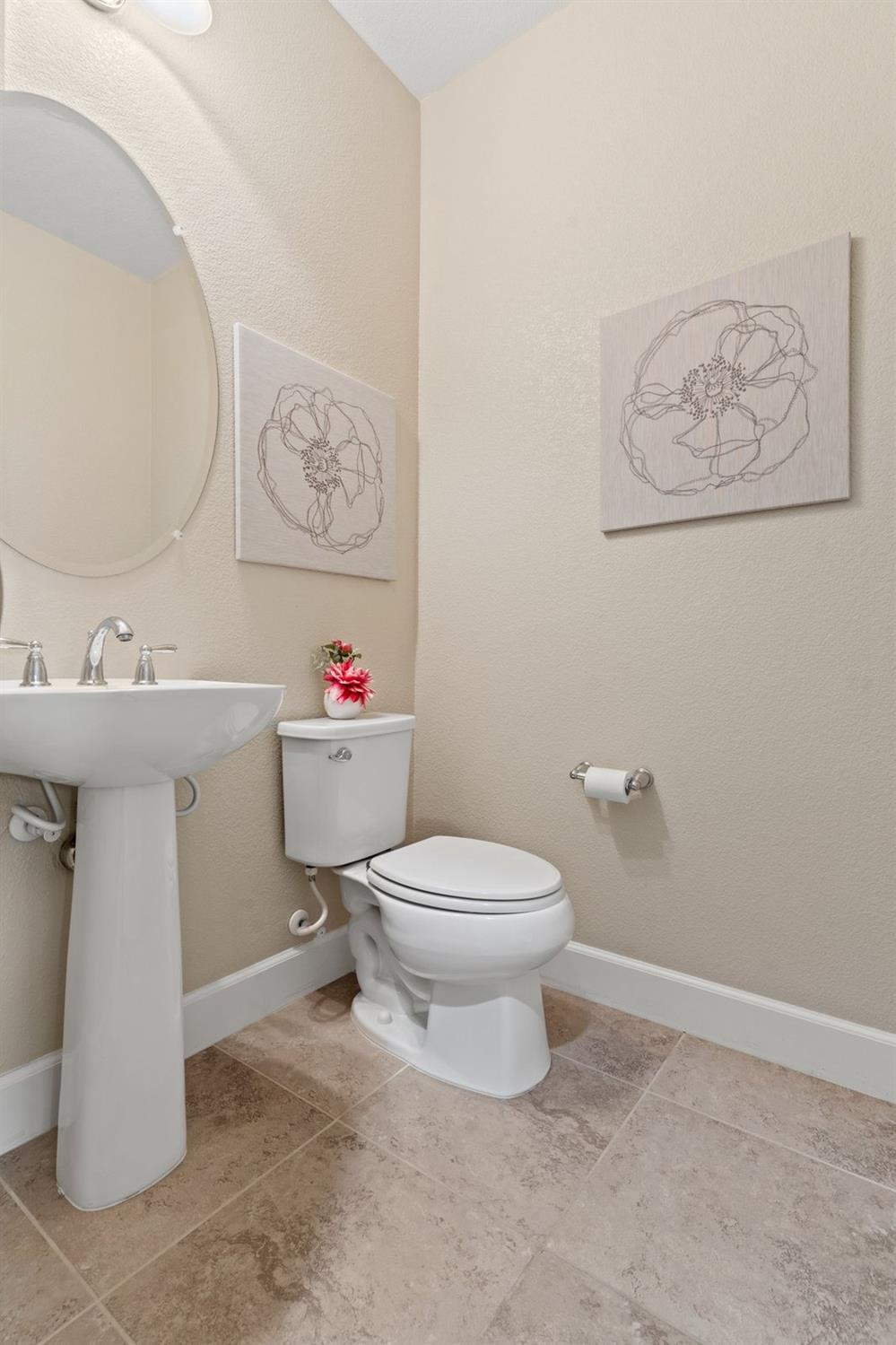 6307 Lookout Pass Way Rocklin, CA 95765 - Photo 40 of 72 a bathroom with a toilet sink and mirror