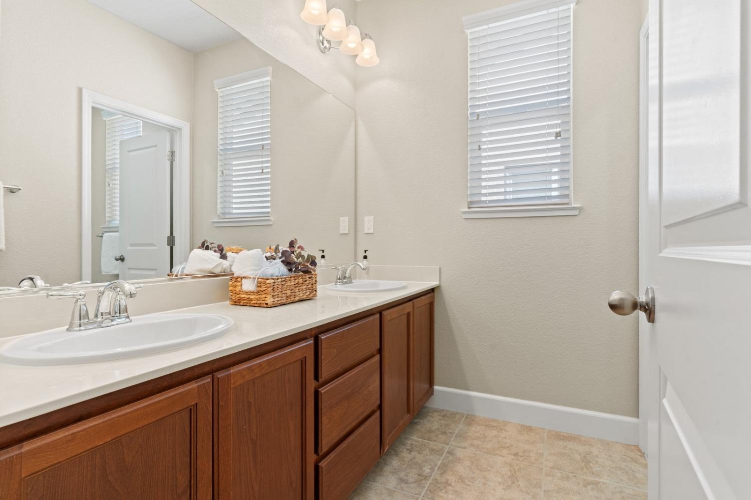 6307 Lookout Pass Way Rocklin, CA 95765 - Photo 43 of 72 a bathroom with a sink and a mirror