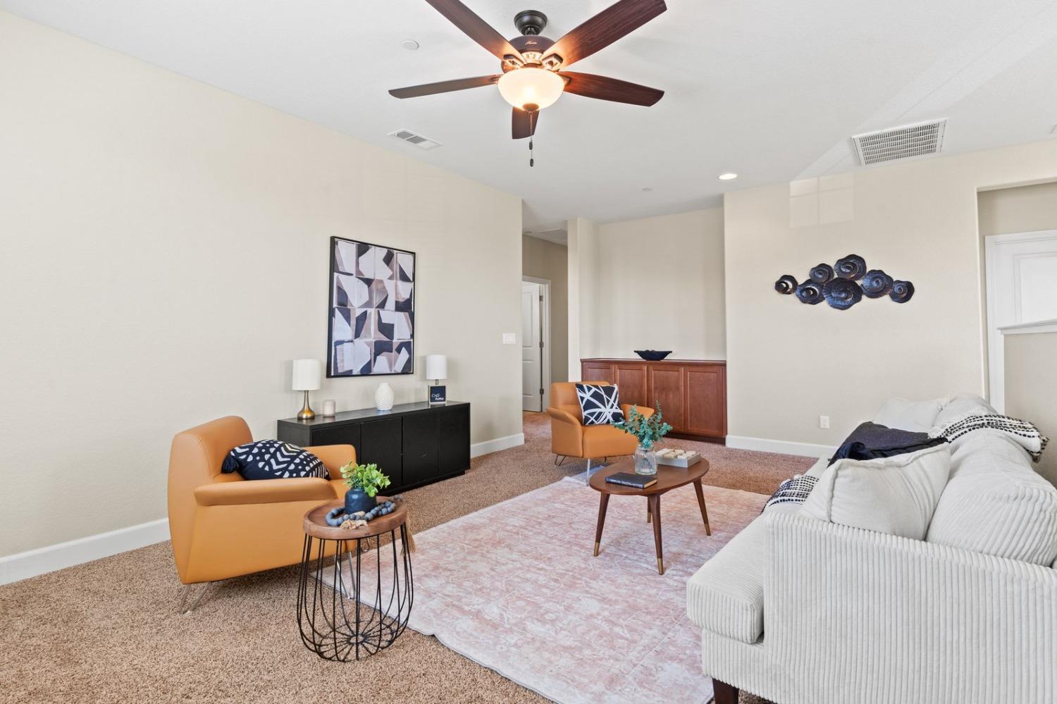 6307 Lookout Pass Way Rocklin, CA 95765 - Photo 53 of 72 a living room with furniture and a ceiling fan