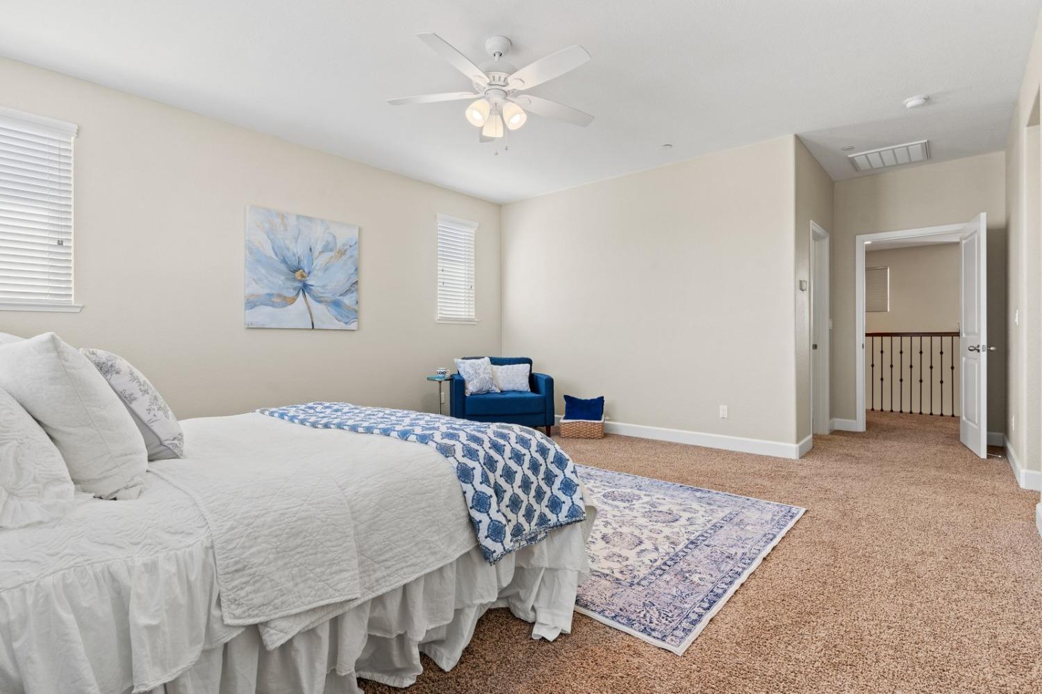 6307 Lookout Pass Way Rocklin, CA 95765 - Photo 59 of 72 a bedroom with a bed and a chandelier