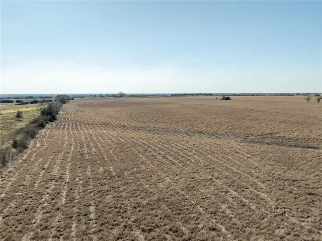 a view of a yard with an ocean