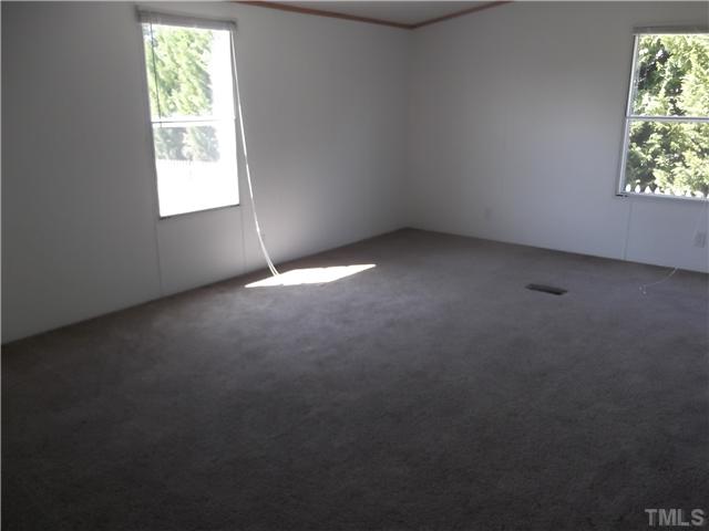 695 Oliver Loop Road Roxboro, NC 27574 - Photo 6 of 8 LARGE SECOND BEDROOM