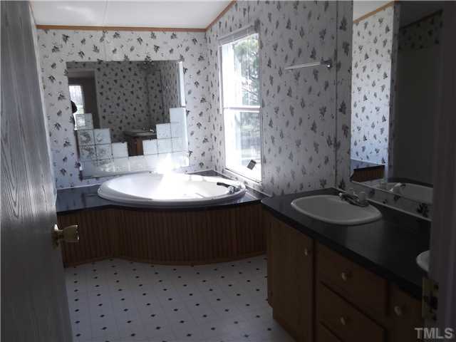695 Oliver Loop Road Roxboro, NC 27574 - Photo 7 of 8 MASTER BATH WITH GARDEN TUB AND SEPARATE SHOWER