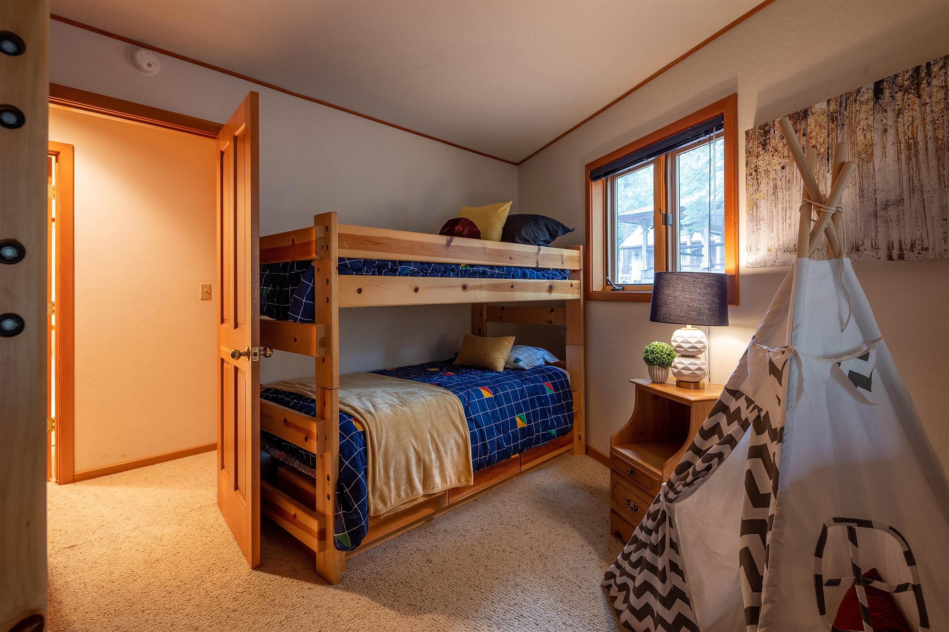 11406 Chalet Road Truckee, CA 96161 - Photo 13 of 21 a bedroom with a bed and glass door