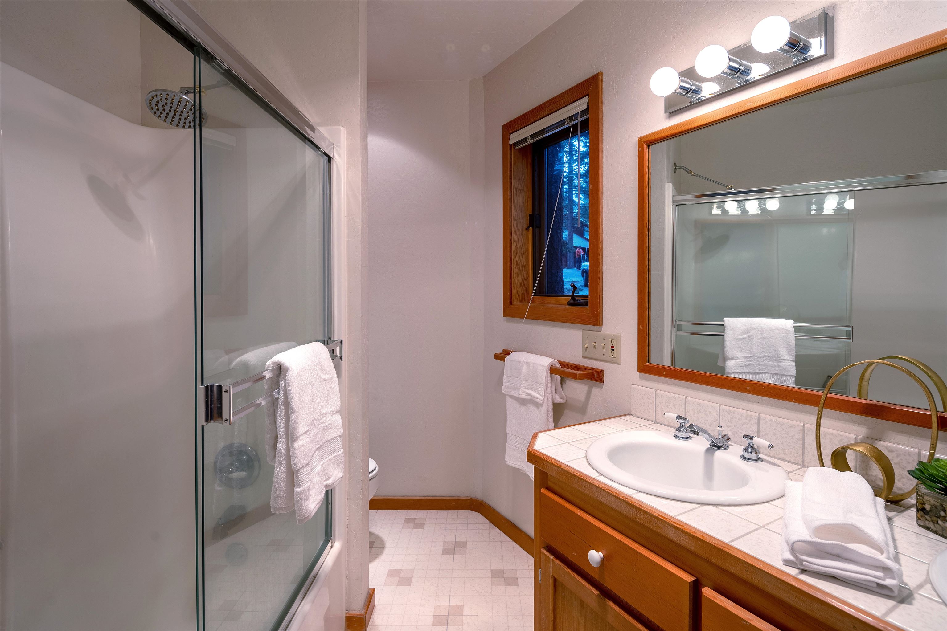11406 Chalet Road Truckee, CA 96161 - Photo 15 of 21 a bathroom with a sink and a mirror