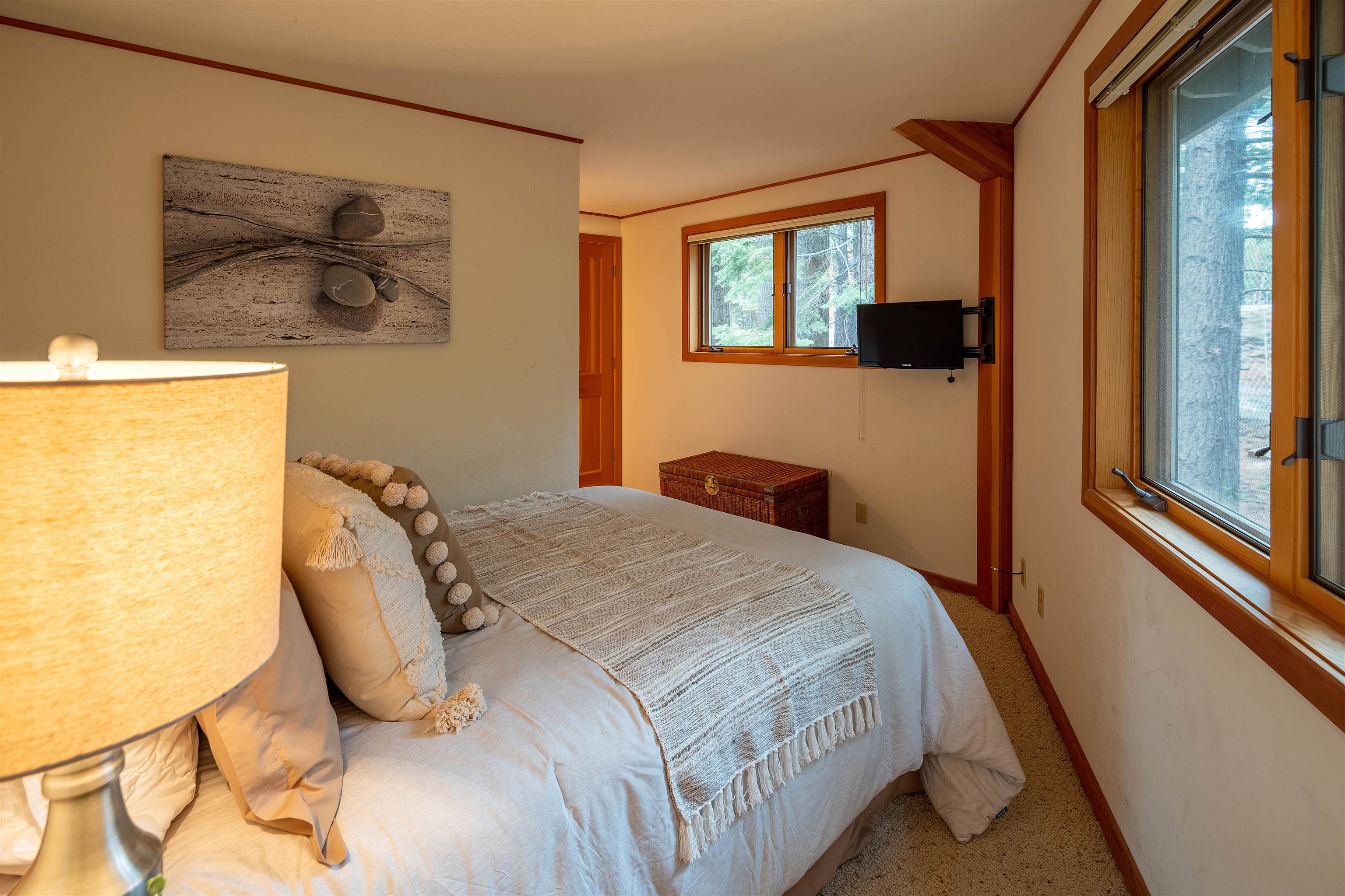 11406 Chalet Road Truckee, CA 96161 - Photo 6 of 21 a bedroom with a bed and a painting on the wall
