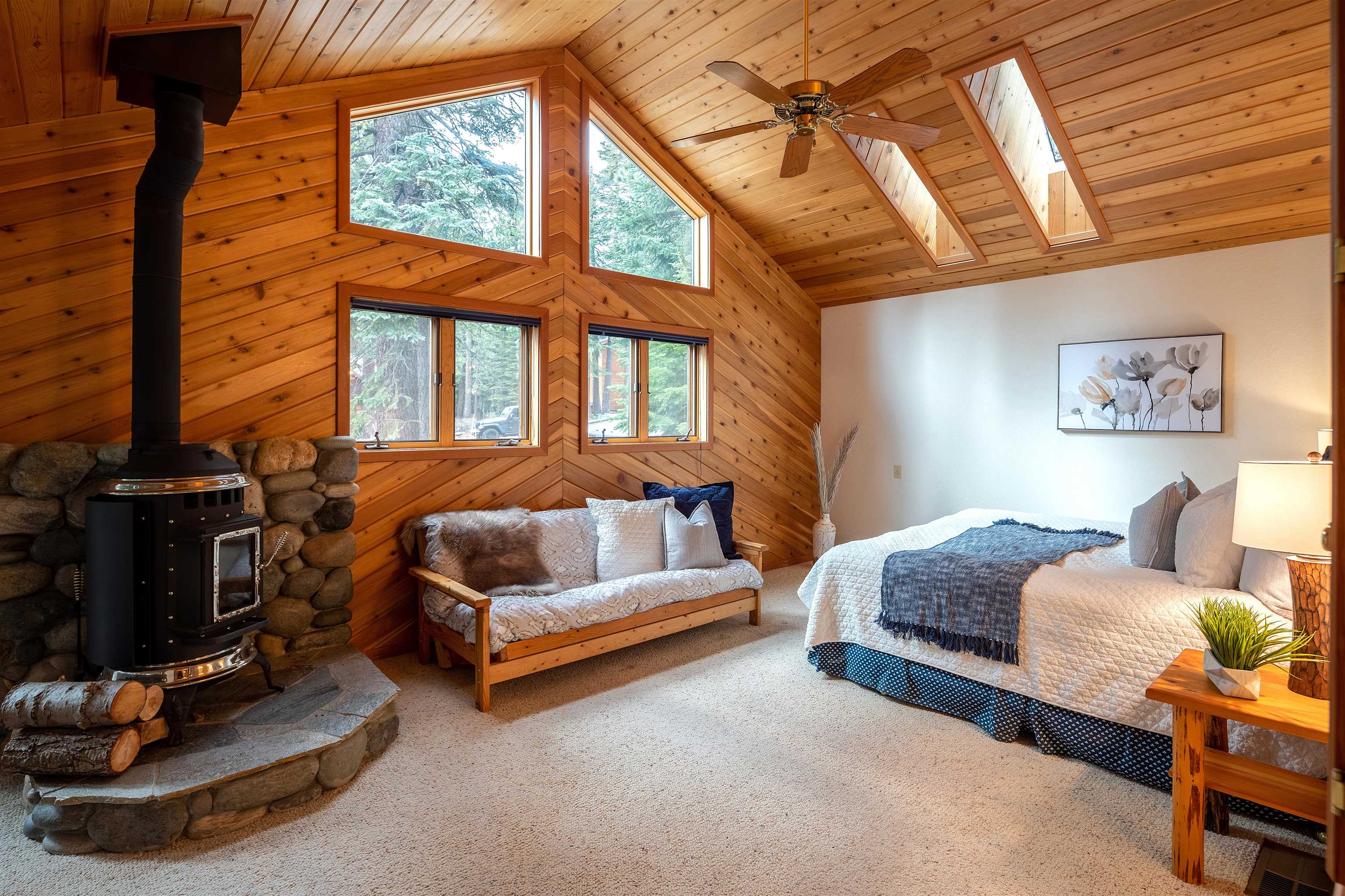 11406 Chalet Road Truckee, CA 96161 - Photo 7 of 21 a bedroom with a bed a dresser next to a window