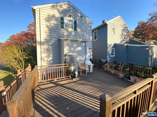 a view of a two chairs in the balcony