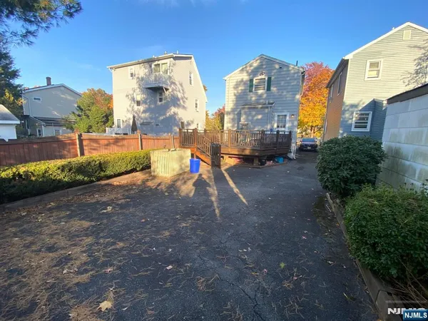a view of outdoor space building and trees in the background