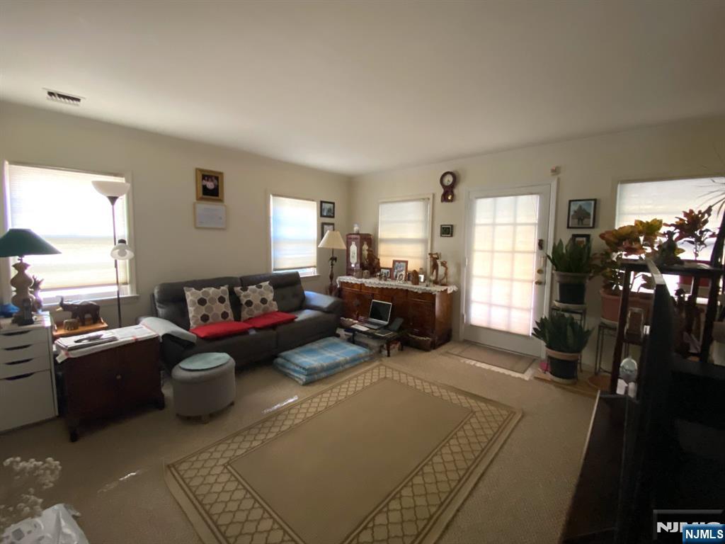 81 5th Street Cresskill, NJ 07626 - Photo 2 of 13 a living room with furniture and a large window