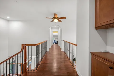 a backyard of a house with fire pit and furniture