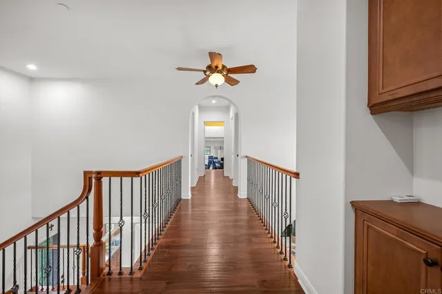 a backyard of a house with fire pit and furniture