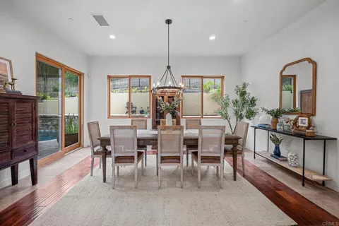 a kitchen with kitchen island granite countertop a sink stove and cabinets