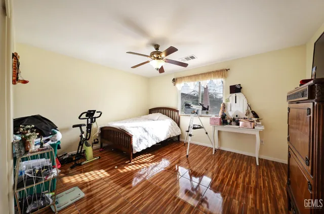a bathroom with a double vanity sink mirror and shower