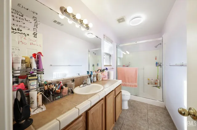 a kitchen with stainless steel appliances sink microwave and cabinets