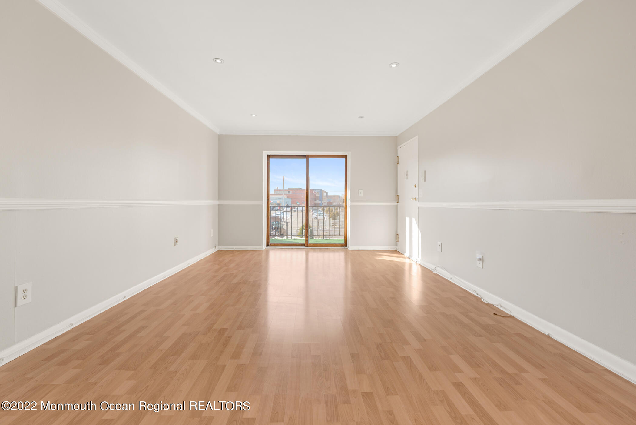 1008 Unicorn Way, Unit R002 Clifton, NJ 07011 - Photo 12 of 30 wooden floor in an empty room with a window