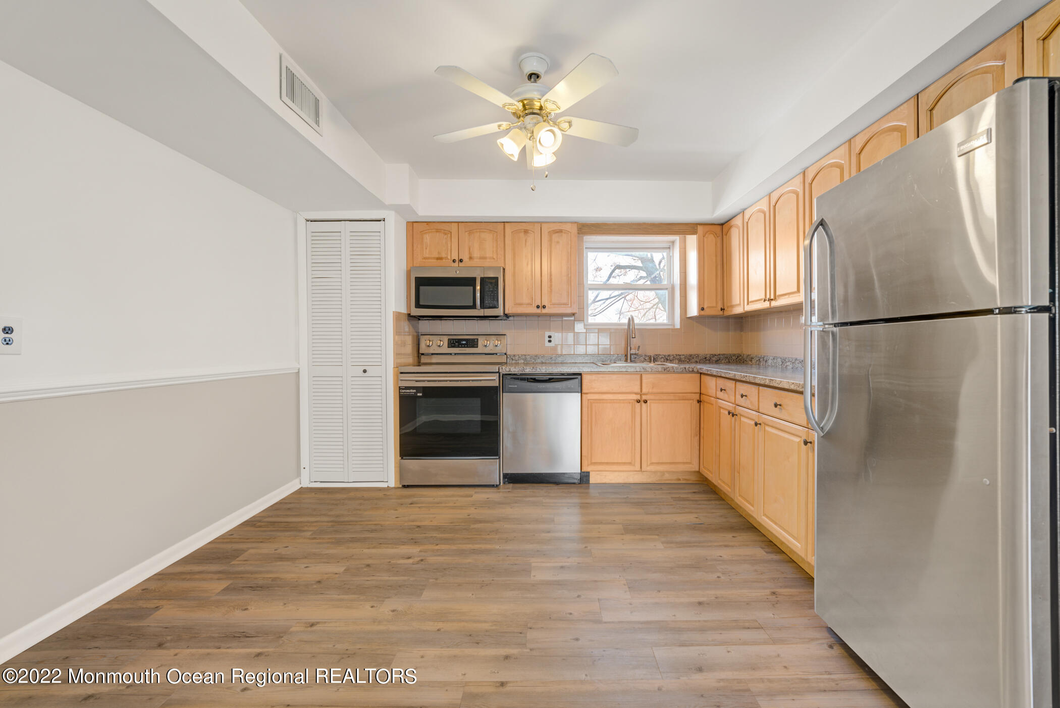 1008 Unicorn Way, Unit R002 Clifton, NJ 07011 - Photo 14 of 30 a kitchen with stainless steel appliances a refrigerator sink and cabinets