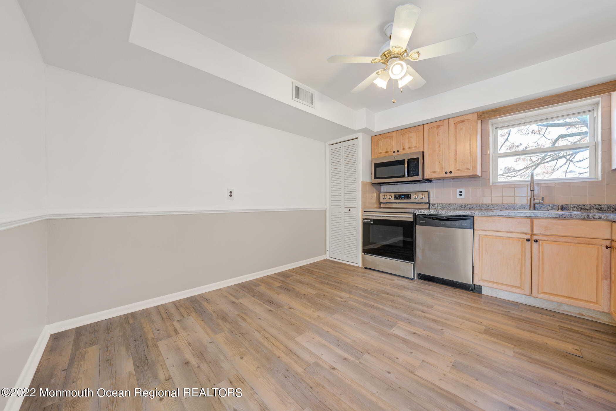 1008 Unicorn Way, Unit R002 Clifton, NJ 07011 - Photo 15 of 30 a view of kitchen with granite countertop cabinets and stainless steel appliances