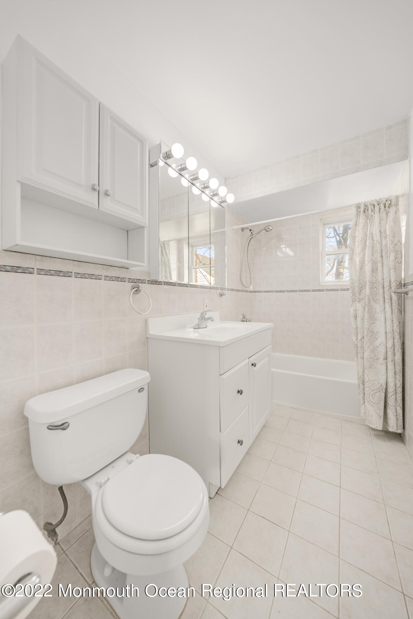 1008 Unicorn Way, Unit R002 Clifton, NJ 07011 - Photo 18 of 30 a bathroom with a toilet sink and mirror