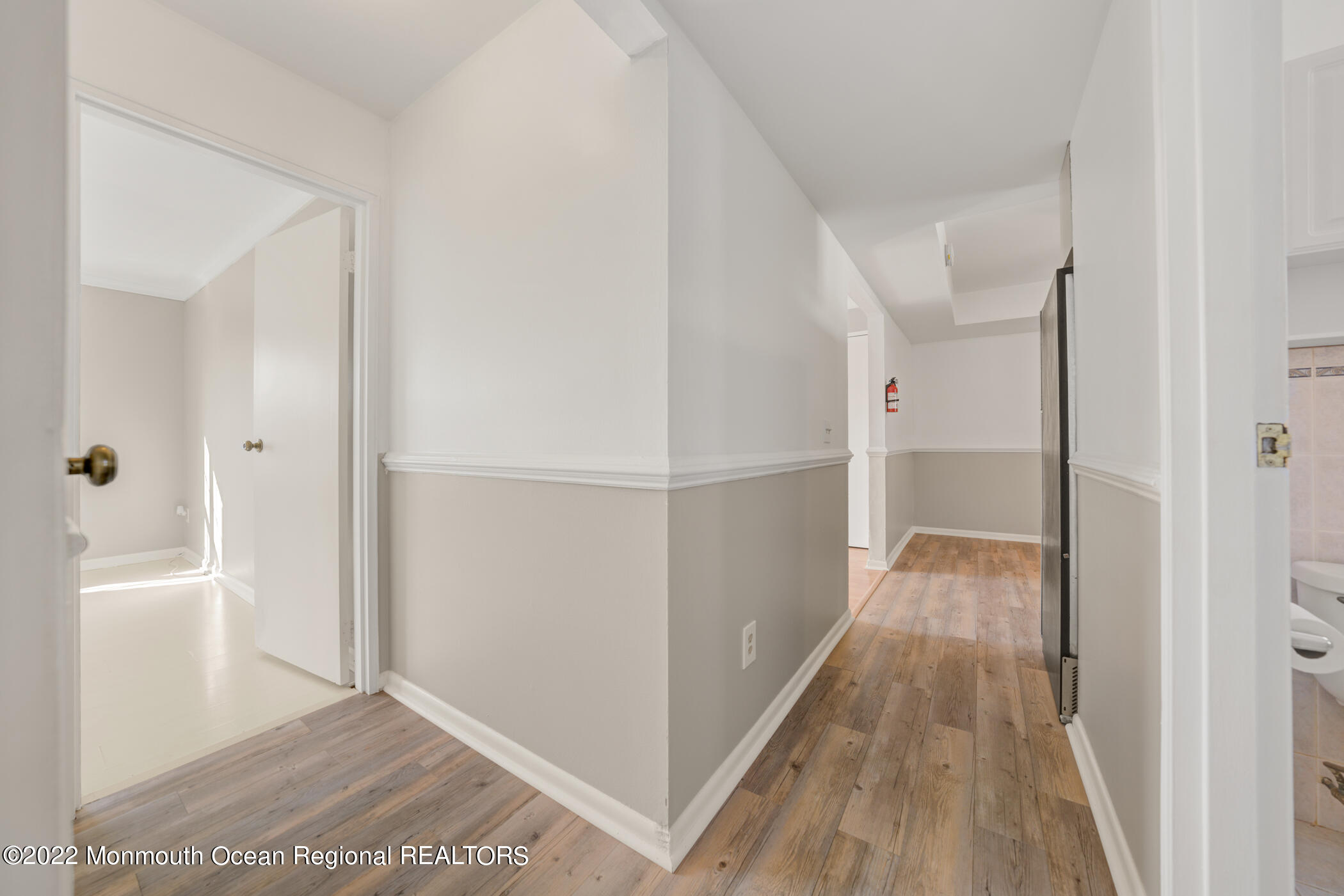 1008 Unicorn Way, Unit R002 Clifton, NJ 07011 - Photo 25 of 30 a view of hallway with wooden floor