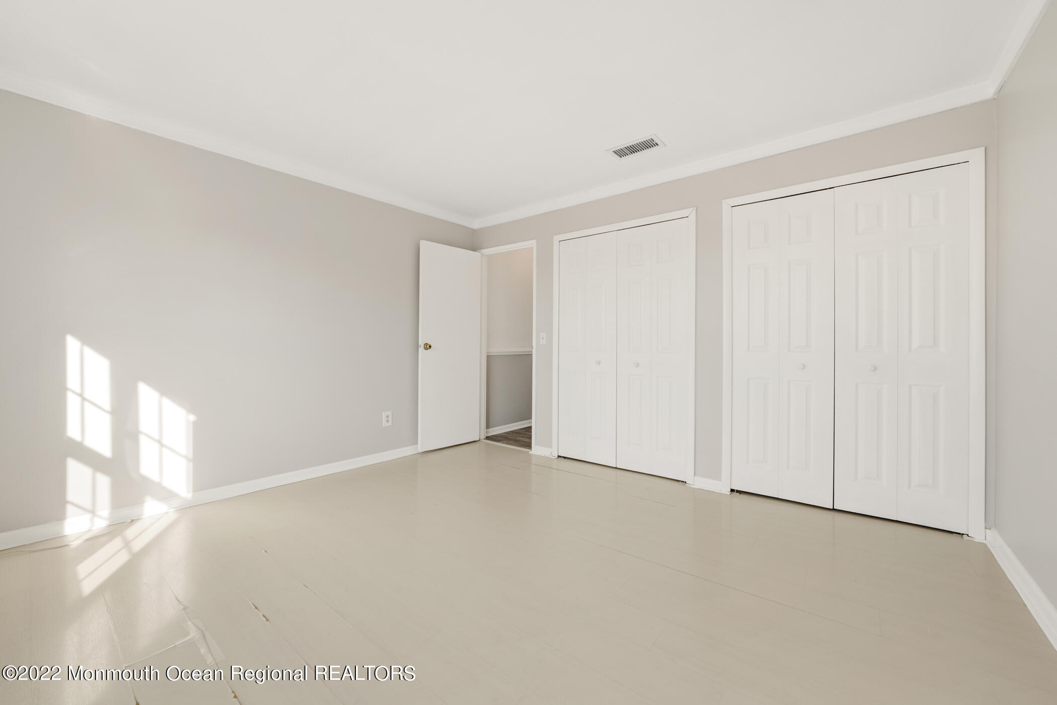 1008 Unicorn Way, Unit R002 Clifton, NJ 07011 - Photo 27 of 30 a view of an empty room and a window