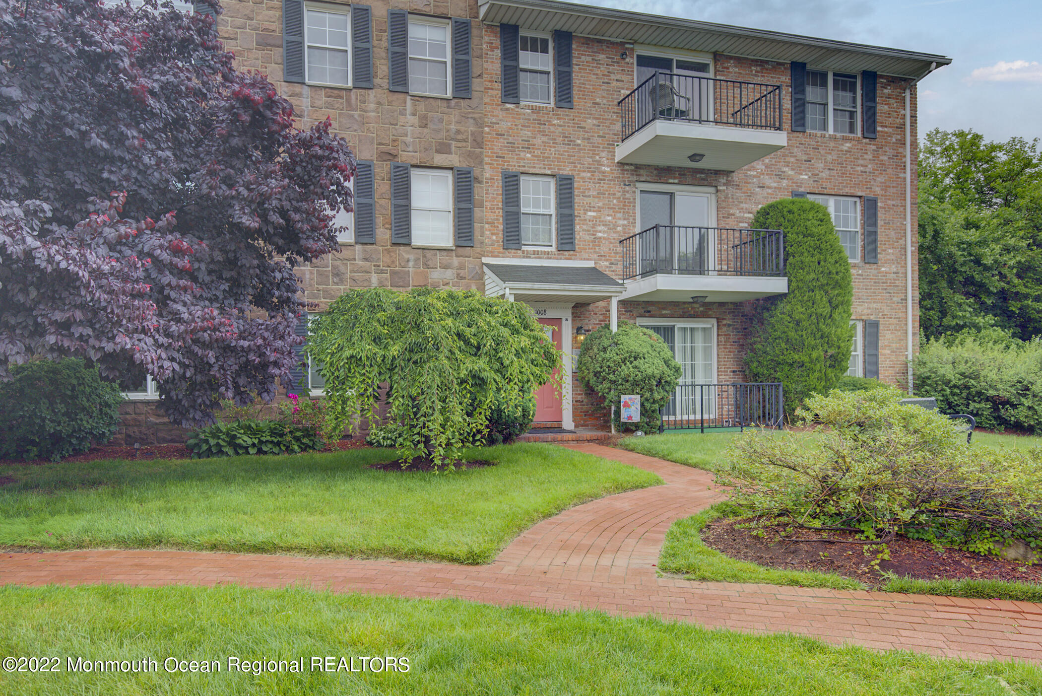 1008 Unicorn Way, Unit R002 Clifton, NJ 07011 - Photo 3 of 30 a front view of a house with a yard