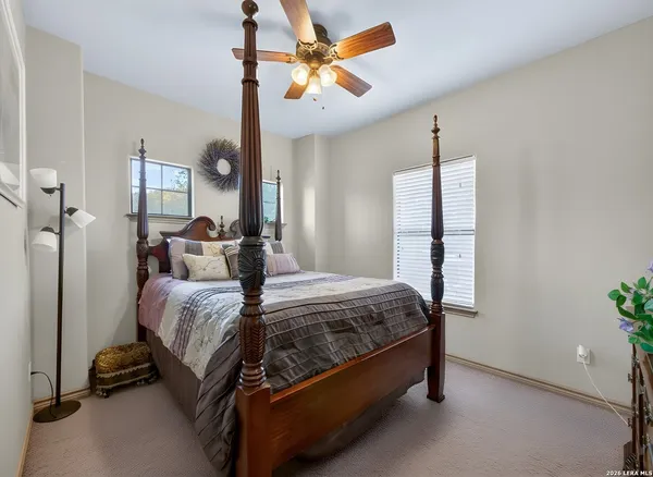 a bed room with a bed and a chandelier