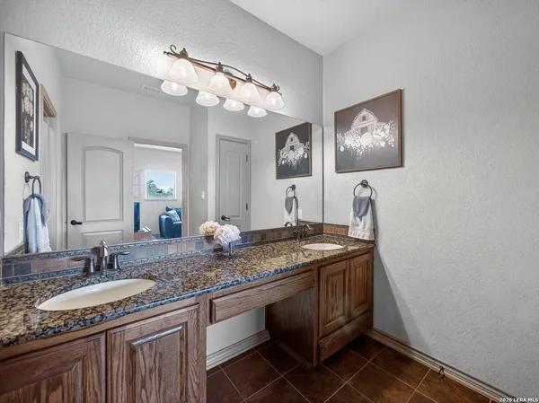a bathroom with a shower and a sink