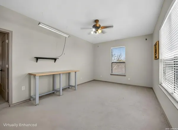 a dining room with furniture a chandelier and wooden floor