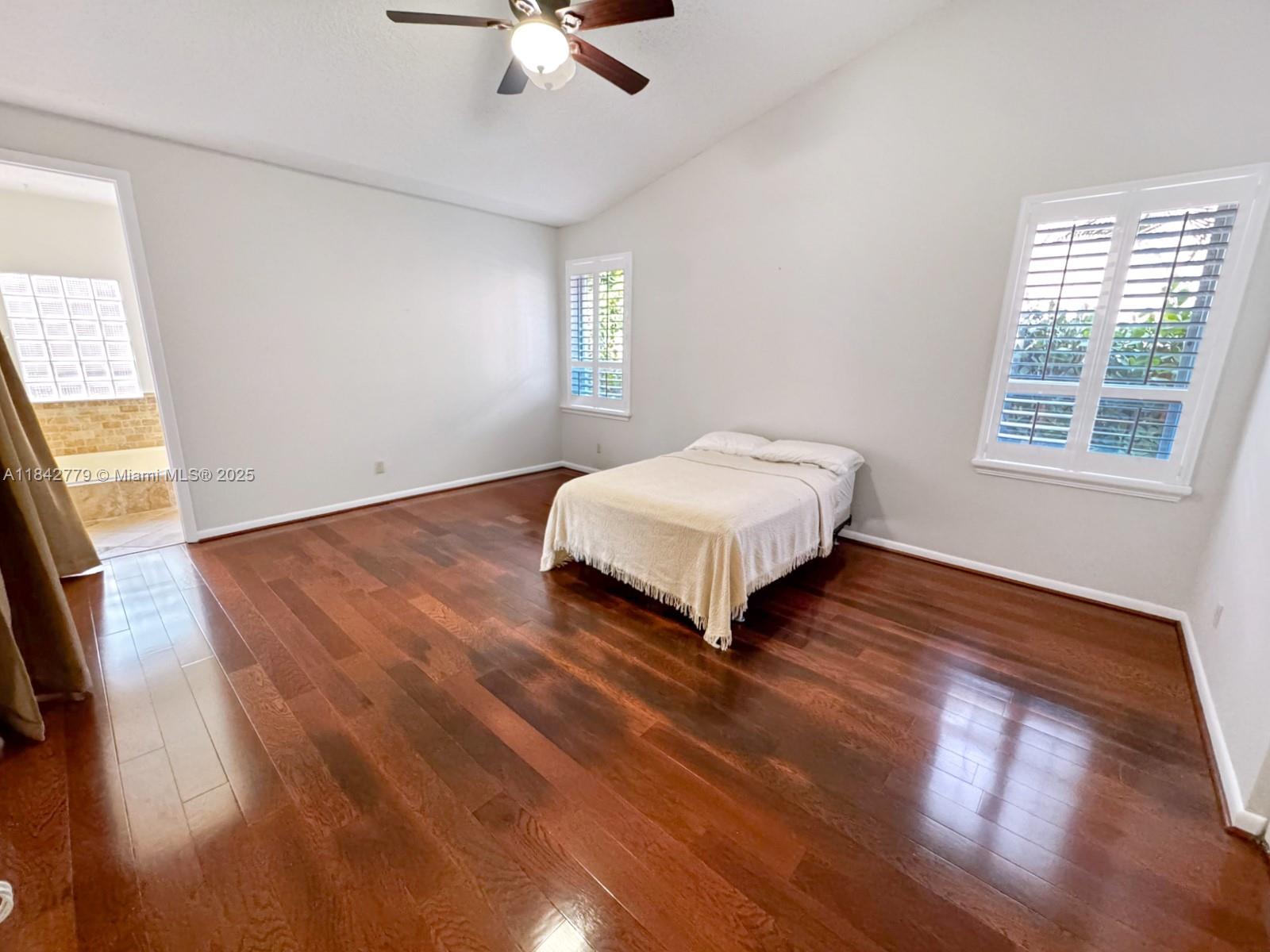10621 Paris Street Cooper City, FL 33026 - Photo 25 of 58 a bedroom with a bed and window
