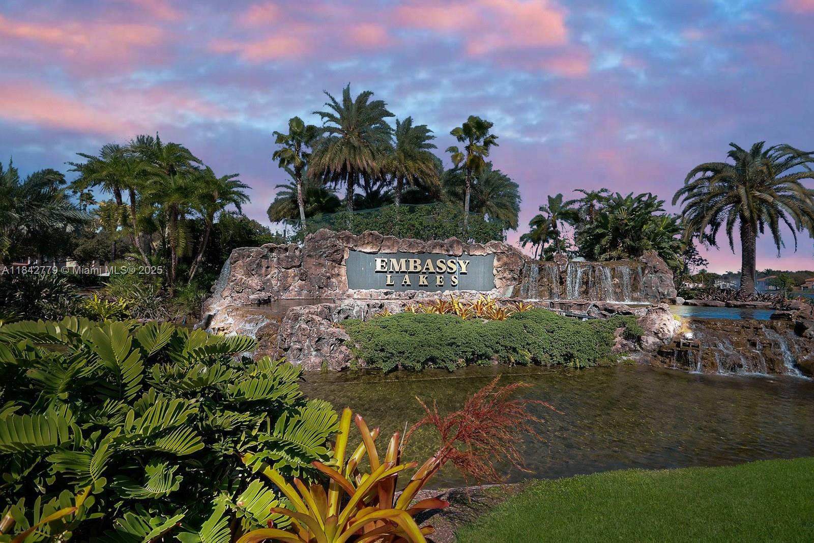 10621 Paris Street Cooper City, FL 33026 - Photo 54 of 58 a view of a street with a building in the background