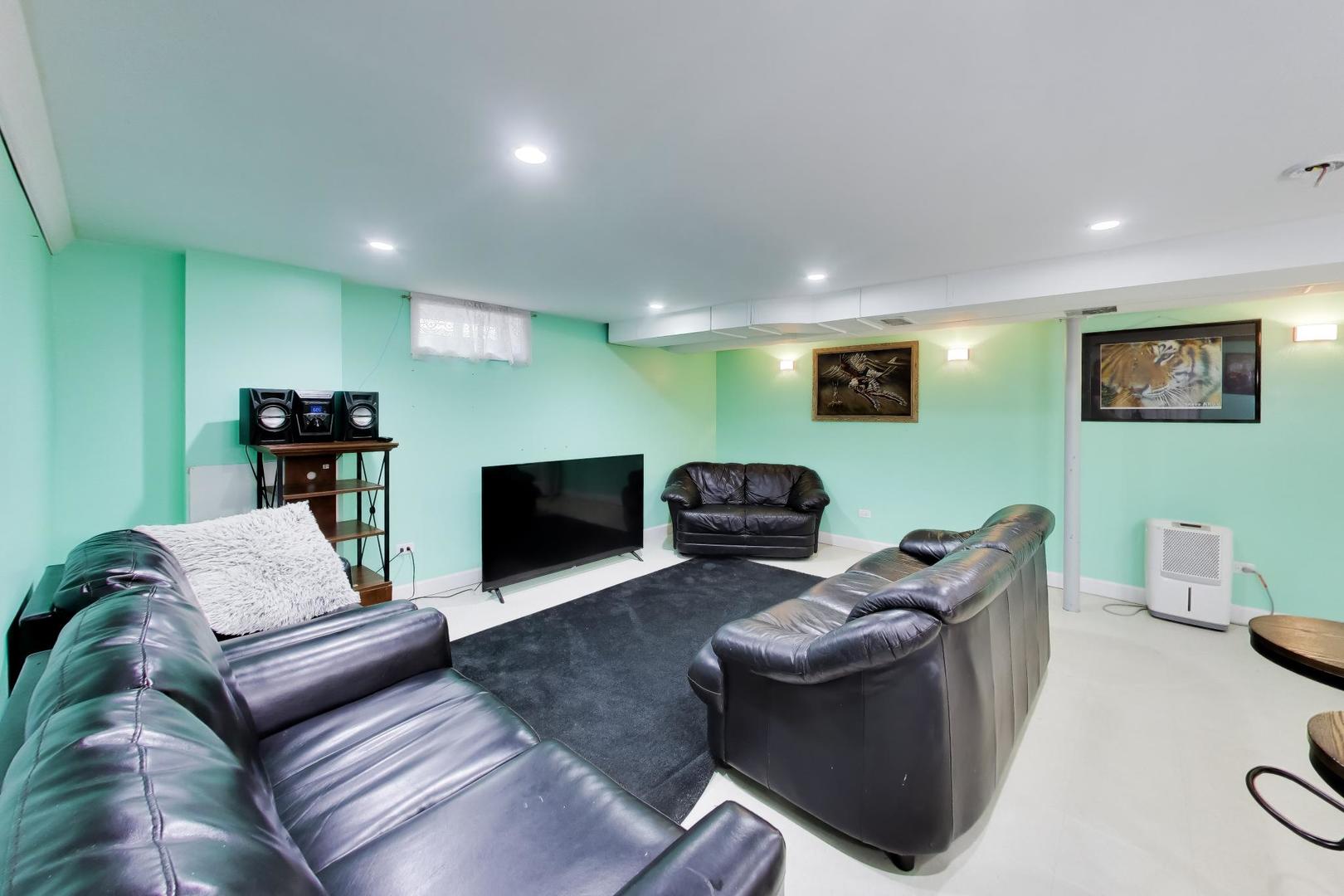 458 West Alma Street Elmhurst, IL 60126 - Photo 16 of 29 a living room with furniture and a fireplace