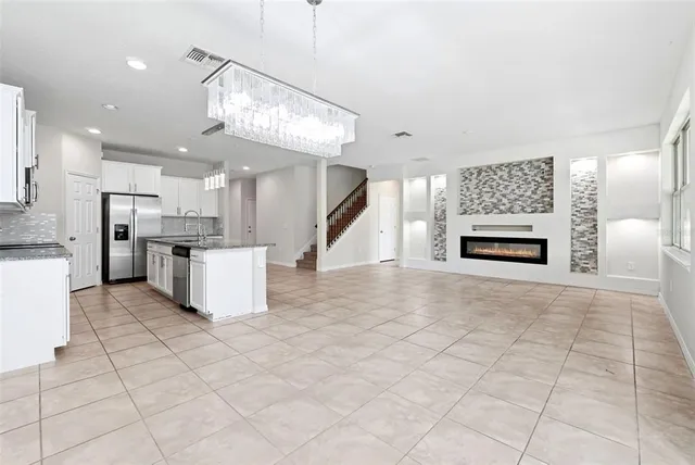 a view of a kitchen with furniture and a fireplace