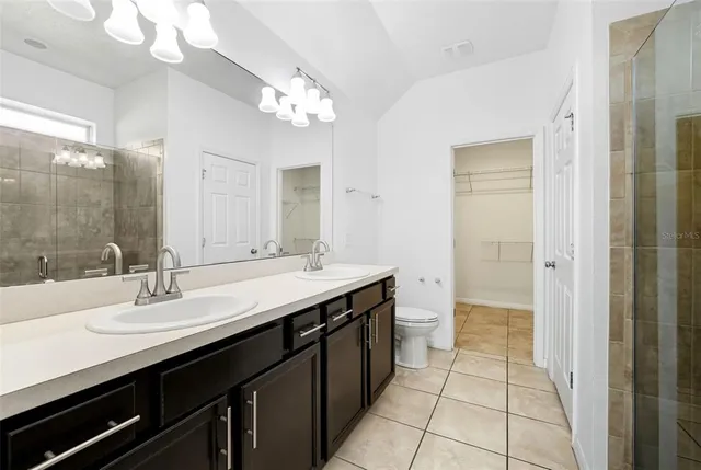 a bathroom with a shower and a sink
