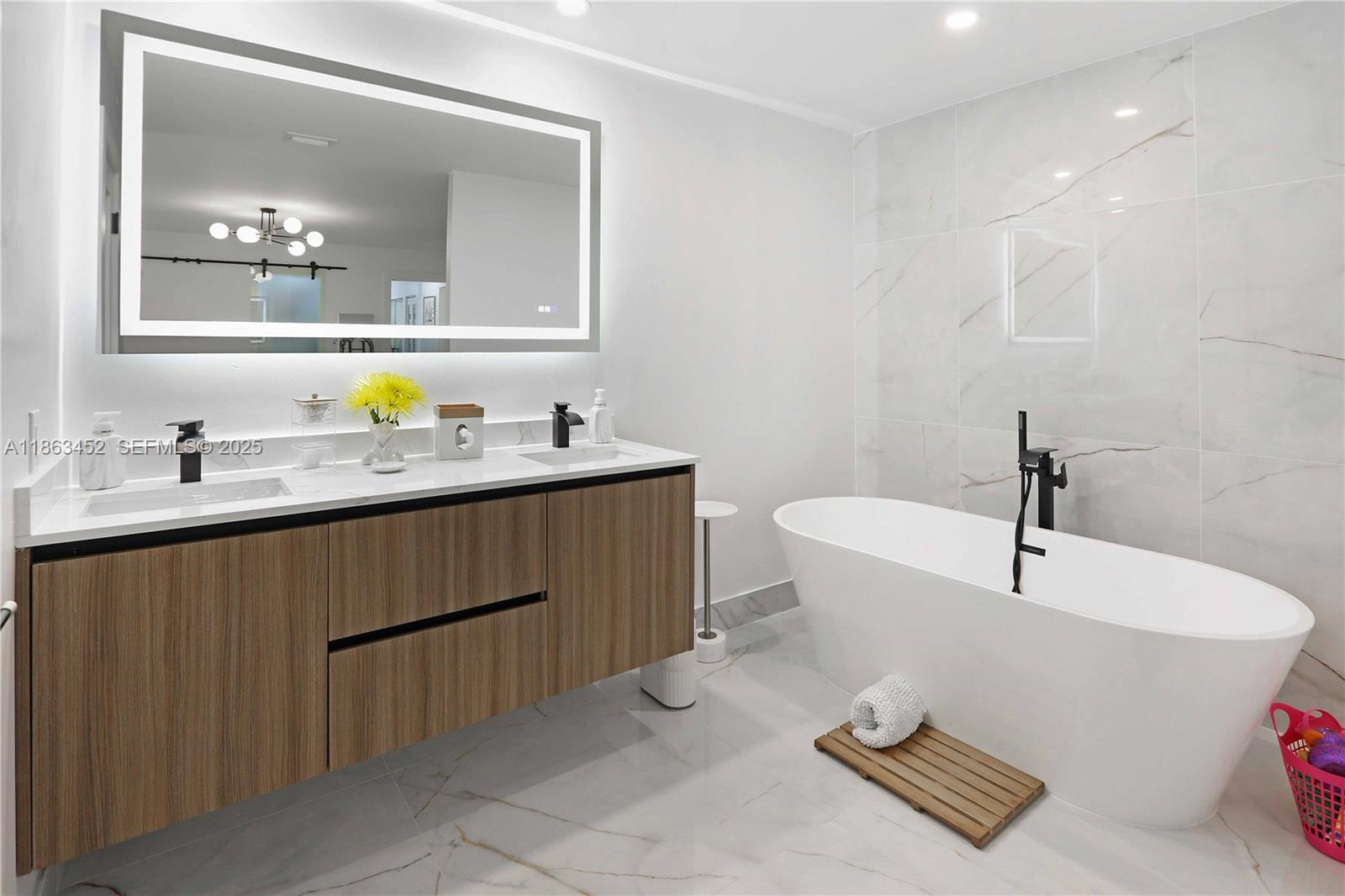 14211 Southwest 31st Street Miami, FL 33175 - Photo 18 of 27 a bathroom with a sink and a mirror