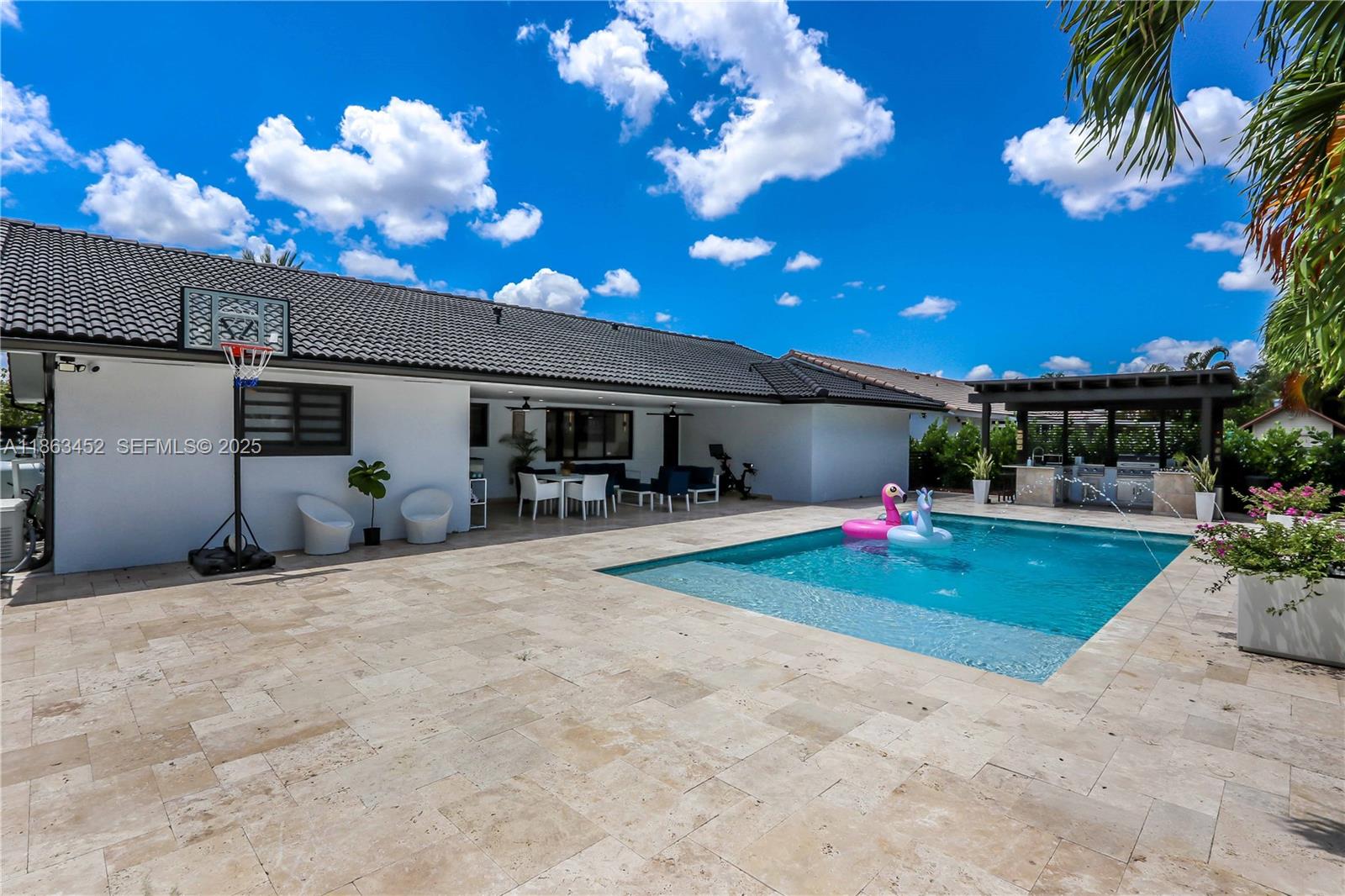 14211 Southwest 31st Street Miami, FL 33175 - Photo 24 of 27 a view of a house with entertaining space and a tree