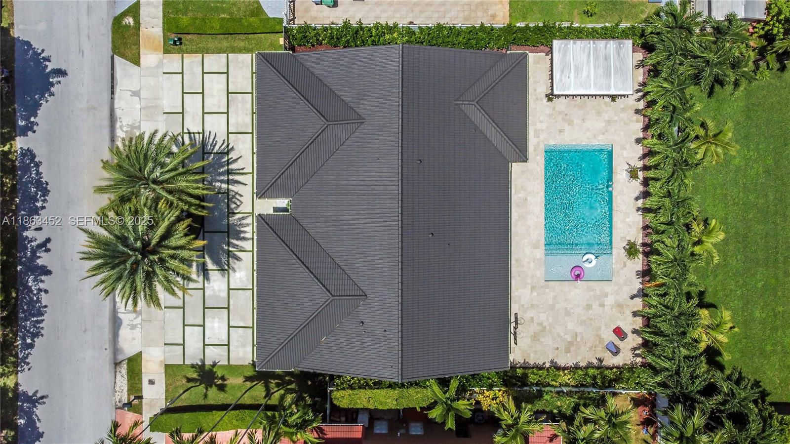 14211 Southwest 31st Street Miami, FL 33175 - Photo 6 of 27 a backyard with potted plants and large tree