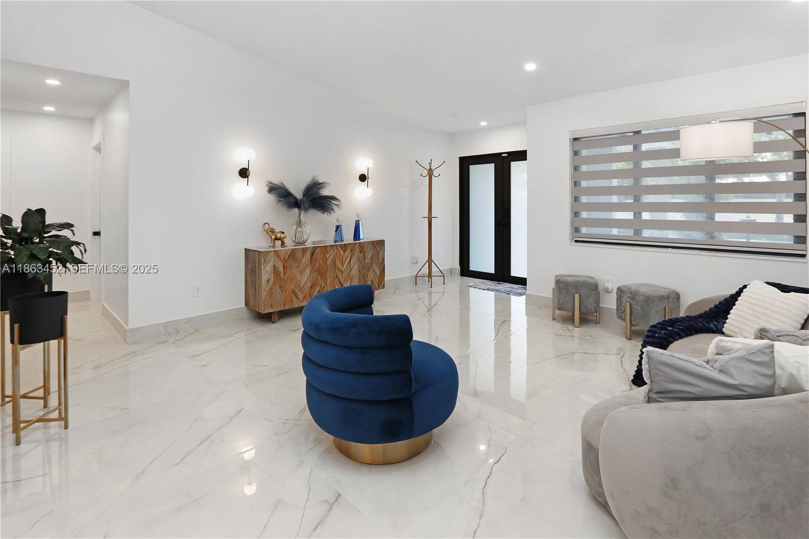 14211 Southwest 31st Street Miami, FL 33175 - Photo 9 of 27 a living room with furniture and a large window