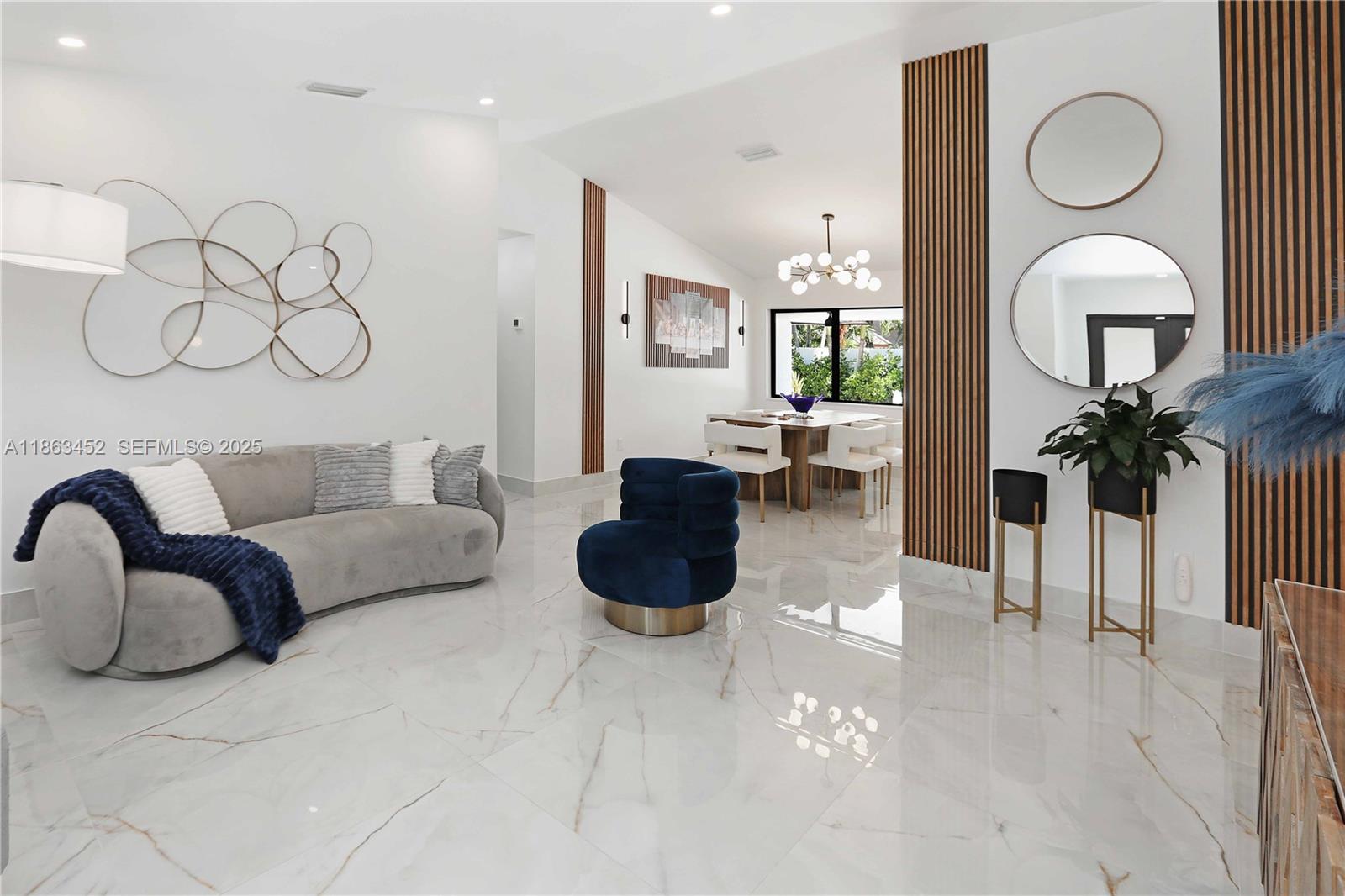 14211 Southwest 31st Street Miami, FL 33175 - Photo 10 of 27 a living room with furniture potted plant and a fireplace