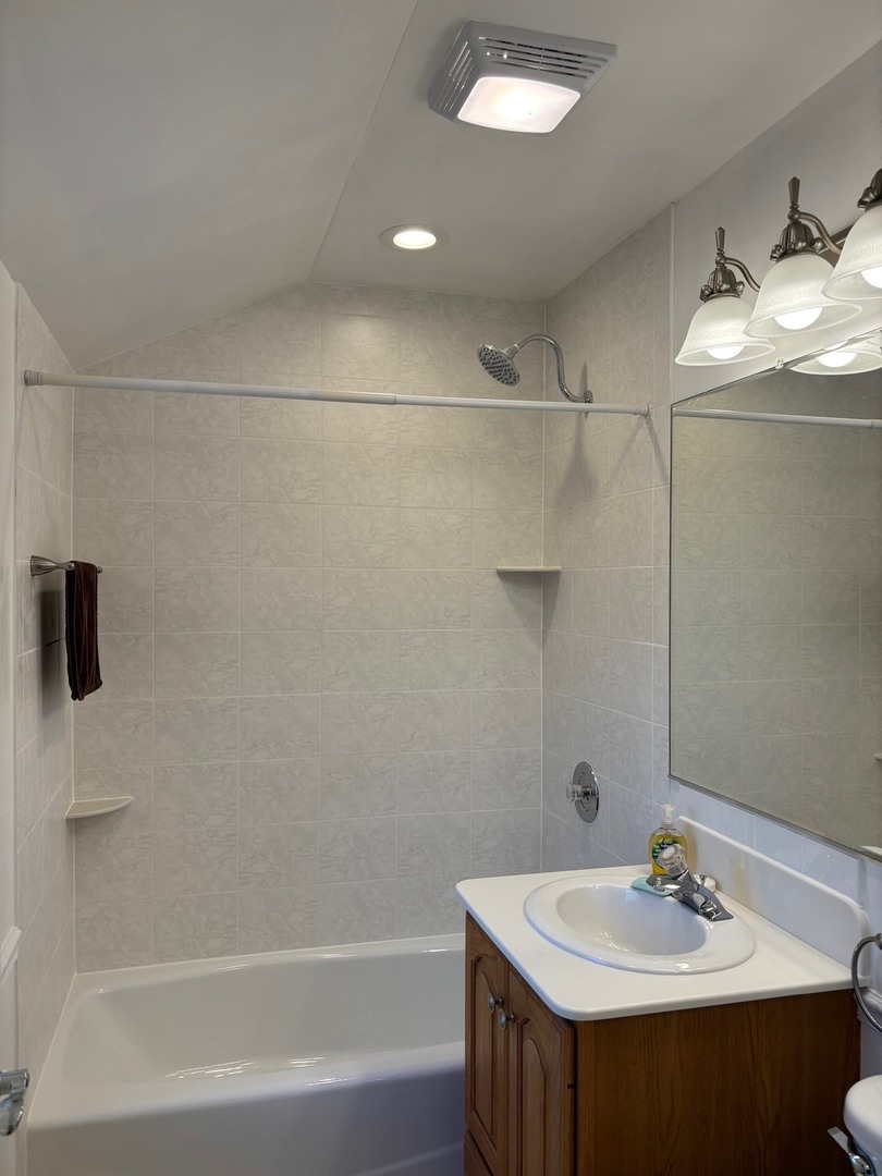 2003 Newton Avenue Park Ridge, IL 60068 - Photo 11 of 21 a bathroom with a sink and a mirror