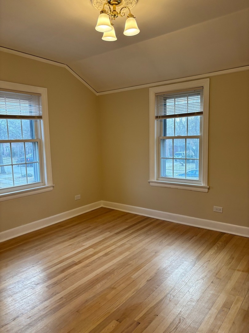 2003 Newton Avenue Park Ridge, IL 60068 - Photo 9 of 21 a view of an empty room with wooden floor and a window