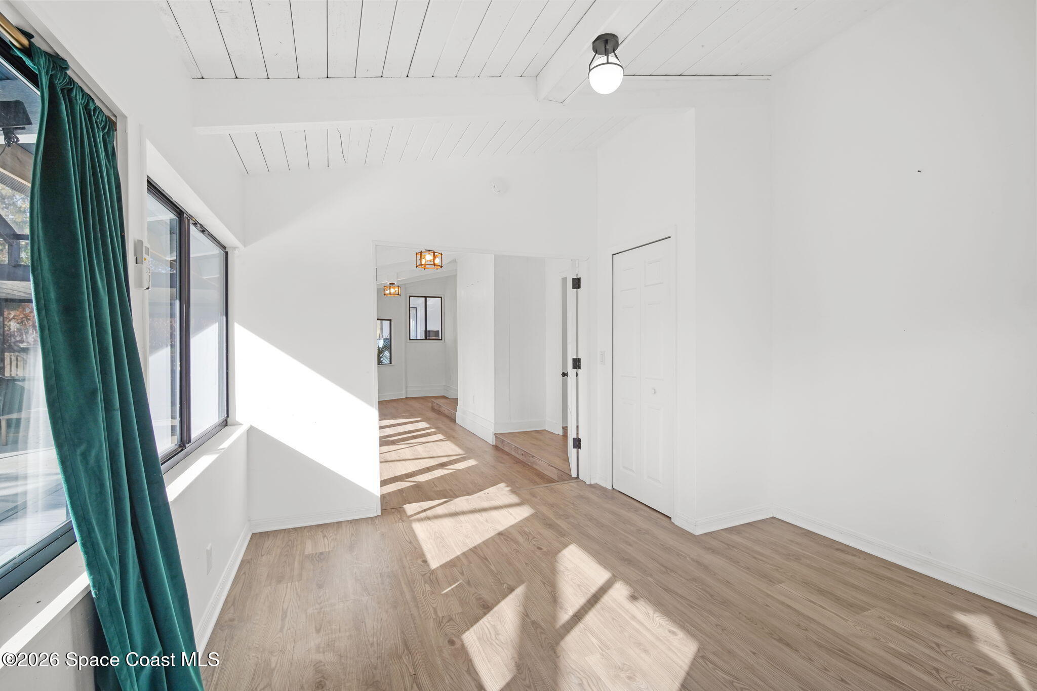 470 South Carpenter Road Titusville, FL 32796 - Photo 28 of 55 a view of entryway with wooden floor and a livingroom
